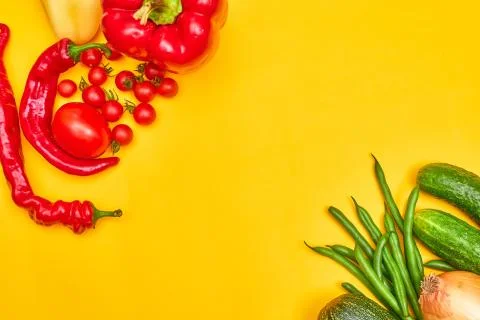 Vegetables on yellow background, copy space Stock Photos
