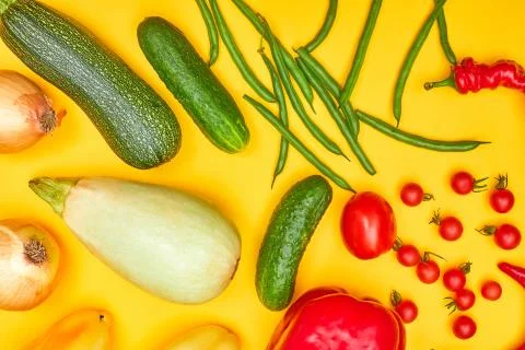 Vegetables on yellow background, flatlay one Stock Photos