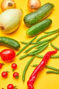 Vegetables on a yellow background side view one Stock Photos