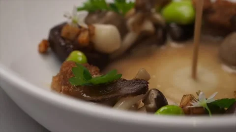 Vegetarian Course At A Tasting Menu - Truffle Sauce Pouring Into A Mushroom Dish Stock Footage 133138300