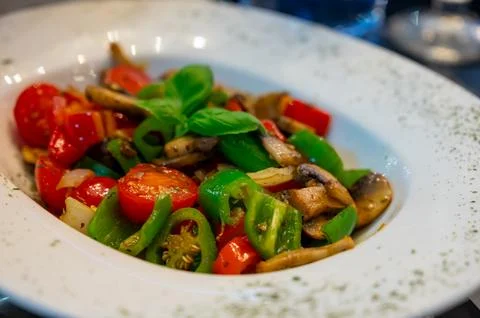 Vegetarian dishes, mezze in Turkish restaurant, grilles mushrooms, pepper a.. Stock Photos