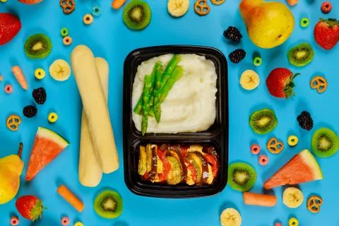 Vegetarian lunch in a container. Mashed potatoes with asparagus and vegetable Stock Photos