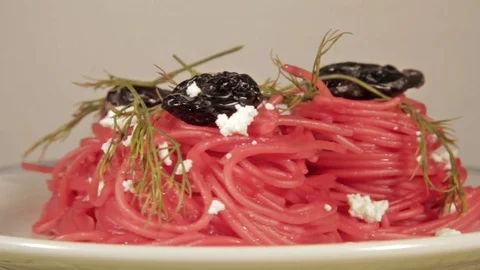 Vegetarian pasta with beetroot sauce, prunes and cheese Stock Footage 70177407