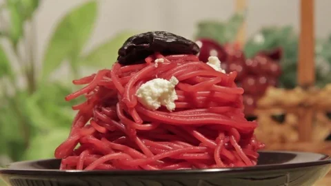 Vegetarian pasta with beetroot sauce, prunes and cheese Stock Footage 70177922
