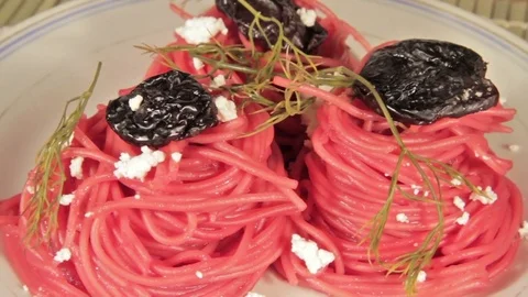 Vegetarian pasta with beetroot sauce, prunes and cheese Stock Footage 70177935