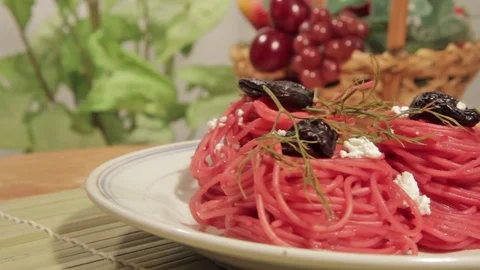 Vegetarian pasta with beetroot sauce, prunes and cheese Stock Footage 70177992