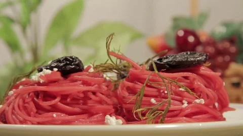 Vegetarian pasta with beetroot sauce, prunes and cheese Stock Footage 70178045