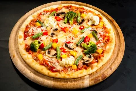 Vegetarian pizza on the board Stock Photos