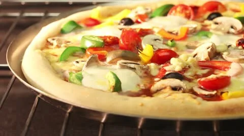 A vegetarian pizza in an oven Stock-Footage 24672216