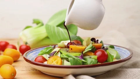 Vegetarian salad of pac choi cabbage poured with vinegar. Side view, close up. Stock Footage 129776997