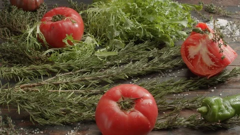Vegetarian set on the table. Fresh herbs, salad and tomatoes Stock Footage 124621782