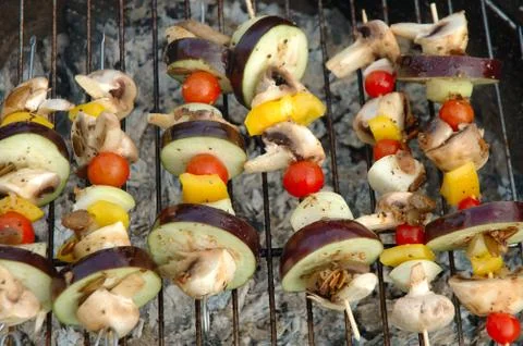 Vegetarian shish-kebab cooking on barbecue Stock Photos