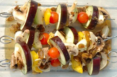 Vegetarian shish-kebab prepared for cooking on barbecue Stock Photos