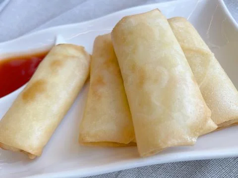 Vegetarian spring roll with cabbage on plate with sauce. Asian cuisine. Healthy Stock Photos