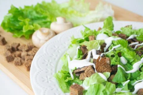Vegetarian version of classic Caesar salad with mushrooms Foto stock