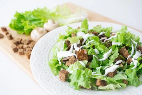 Vegetarian version of classic Caesar salad with mushrooms Stock Photos