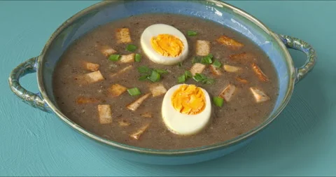 Vegetarian version of sour rye soup with tofu and eggs. Stock Footage 332850581