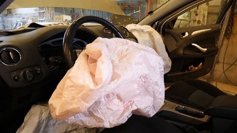 Vehicle airbag deployed to save the driver during a crash - after the Stock Footage 126521647