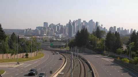 Vehicle and train traffic timelapse with Calgary city skyline beyond Stock Footage 317145144
