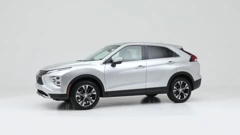 Vehicle bodywork in studio Atomic Silver 2022 Mitsubishi Eclipse Cross SE CUV Stock Footage 159365923