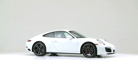 Vehicle bodywork in studio Ruby Red Tinted Clearcoat 2017 Porsche 911 Carrera 4S Stock Footage 159533855