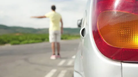 Vehicle breakdown on the road, man looking for help in the mid Vidéo 271646579