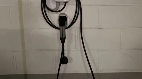 Vehicle cable electric car in park to recharge vehicle Vídeos de archivo 236123731