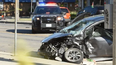 Vehicle damaged after auto collision with police car Stock Footage 104375630