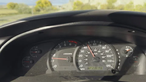 Vehicle dashboard with speedometer in motion Stock Footage 303949183