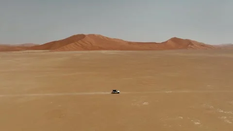 Vehicle drives through sand dunes of Empty Quarter, Rub al-Chali in Oman Stock Footage 331665935