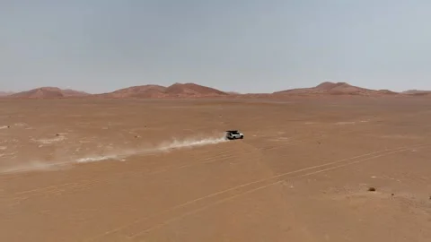 Vehicle drives through sand dunes of Empty Quarter, Rub al-Chali in Oman Stock Footage 331665948