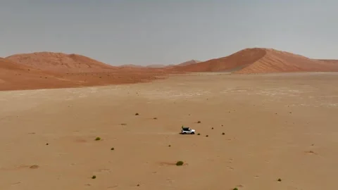Vehicle drives through sand dunes of Empty Quarter, Rub al-Chali in Oman Stock Footage 331666002