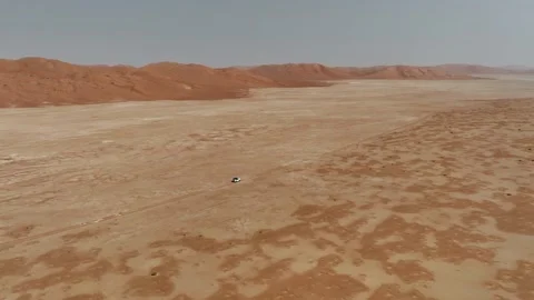 Vehicle drives through sand dunes of Empty Quarter, Rub al-Chali in Oman Stock Footage 331666246