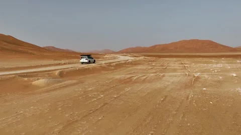Vehicle drives through sand dunes of Empty Quarter, Rub al-Chali in Oman Stock Footage 331667007