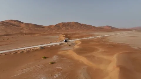 Vehicle drives through sand dunes of Empty Quarter, Rub al-Chali in Oman Stock Footage 331667033