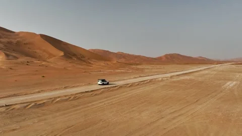 Vehicle drives through sand dunes of Empty Quarter, Rub al-Chali in Oman Stock Footage 331667051