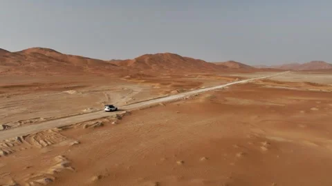 Vehicle drives through sand dunes of Empty Quarter, Rub al-Chali in Oman Stock Footage 331667082