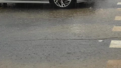 A vehicle driving through heavy rain Stock Footage 333085617
