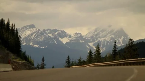 A vehicle driving through the mountains Stock Footage 7752662