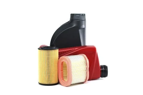 Vehicle engine oil filters elements and motor oil cans isolated on a white Stock Photos