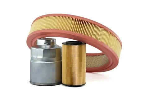 Vehicle engine round air filter, fuel and oil filters isolated on a white Fotos de archivo