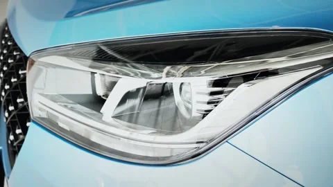 Vehicle headlight, front diode headlights. Sleek Sedan Showroom Spotlight. The Stock Footage 257763408
