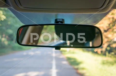 Vehicle interior with rear view mirror and windshield - car salon concept Stock Photos