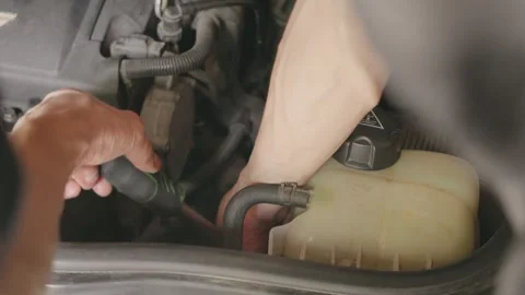 Vehicle Maintenance Its essential to regularly check the coolant system for Stock Footage 284995978