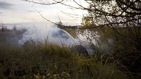 A vehicle with mechanical problems is on the side of the road in an area Stock Footage 112972714