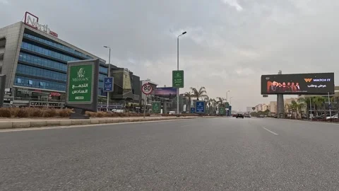 Vehicle Passing Through Contemporary City Streets New Cairo Showing Buildings 库存影片 330101774