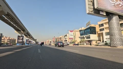 Vehicle Passing Through Elegant Modern City Streets New Cairo Showing Buildings 動画素材 329811648