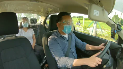Vehicle With Plastic Barrier Being Driven By An Uber Driver During Stock Footage 142525835