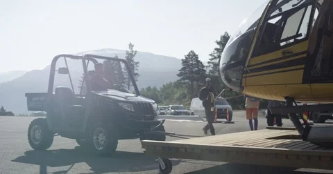 Vehicle Pulling Helicopter On Runway Stock Footage 79755926