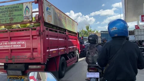 Vehicle Queue at Pertamina Gas Station with LPG Truck Stock Footage 330874931